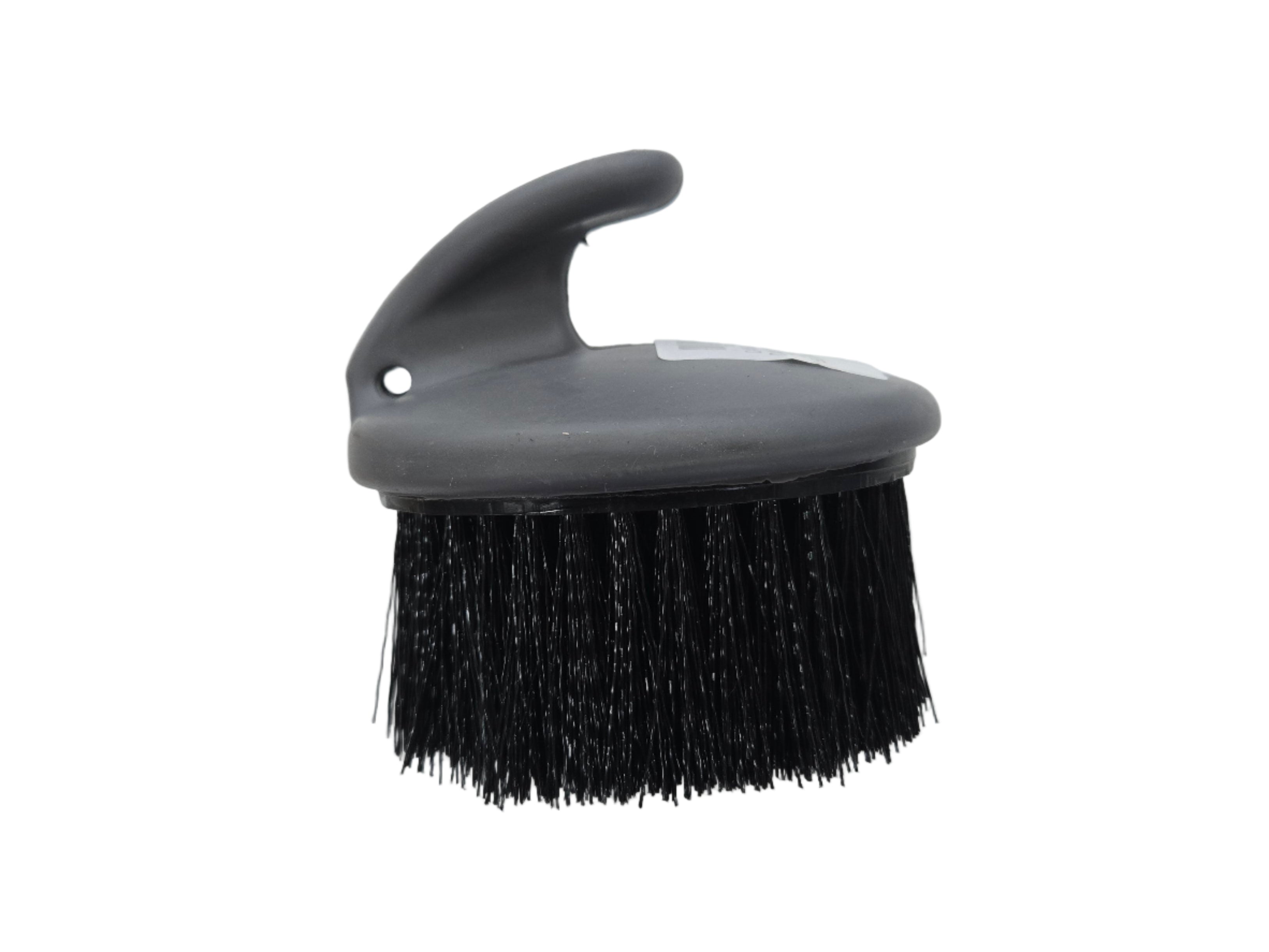 Gray brush with black bristles on a white background